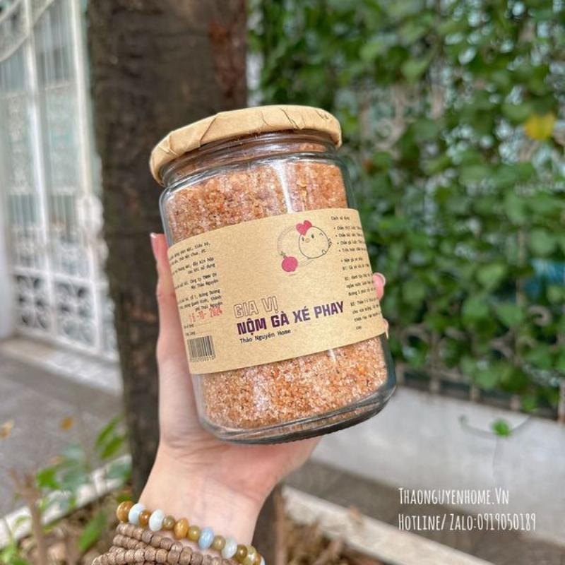 hands seasoning vietnamese balut with salt and rau ram herb